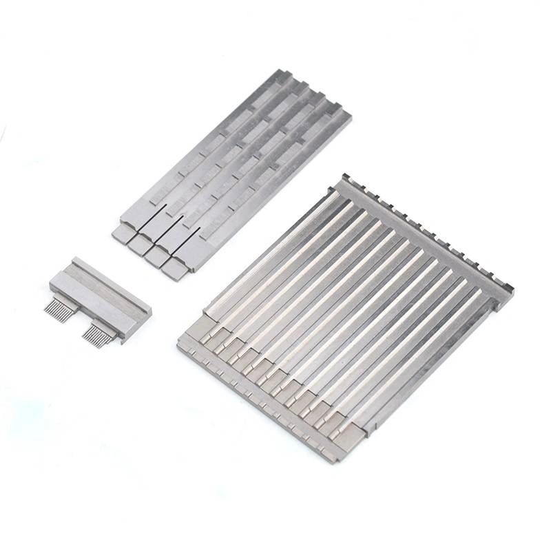 Group of precision machined metal components with parallel slots and fine structural features